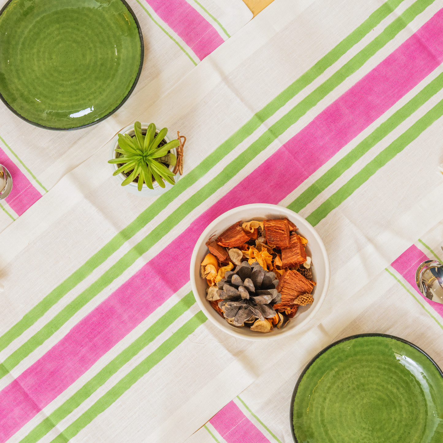 Complete Mez linen table set in pink, runner, placemats, and napkins laid out together