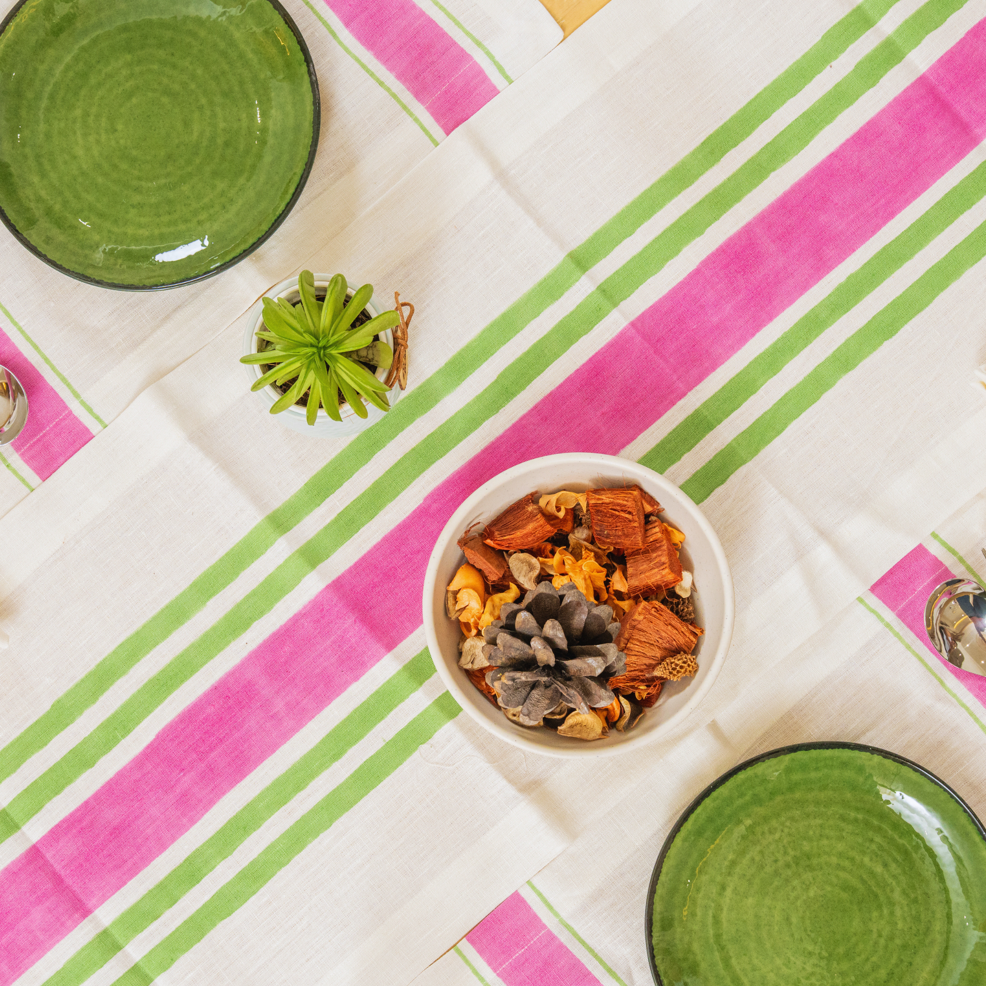 Complete Mez linen table set in pink,  runner, placemats, and napkins laid out together