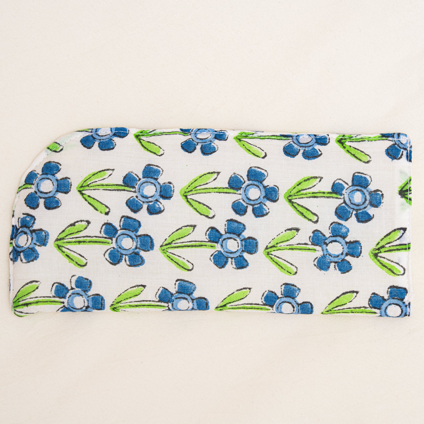 Floral patterned hand block printed pouch with blue flowers and green leaves on a white background
