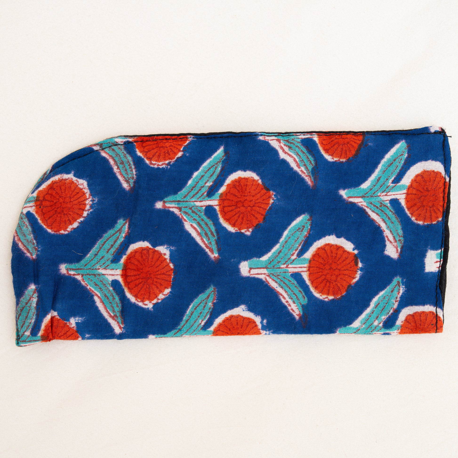 Hand block printed cotton Fabric pouch with red and green floral pattern on a blue background